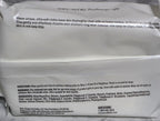White package with text on a gray marble surface