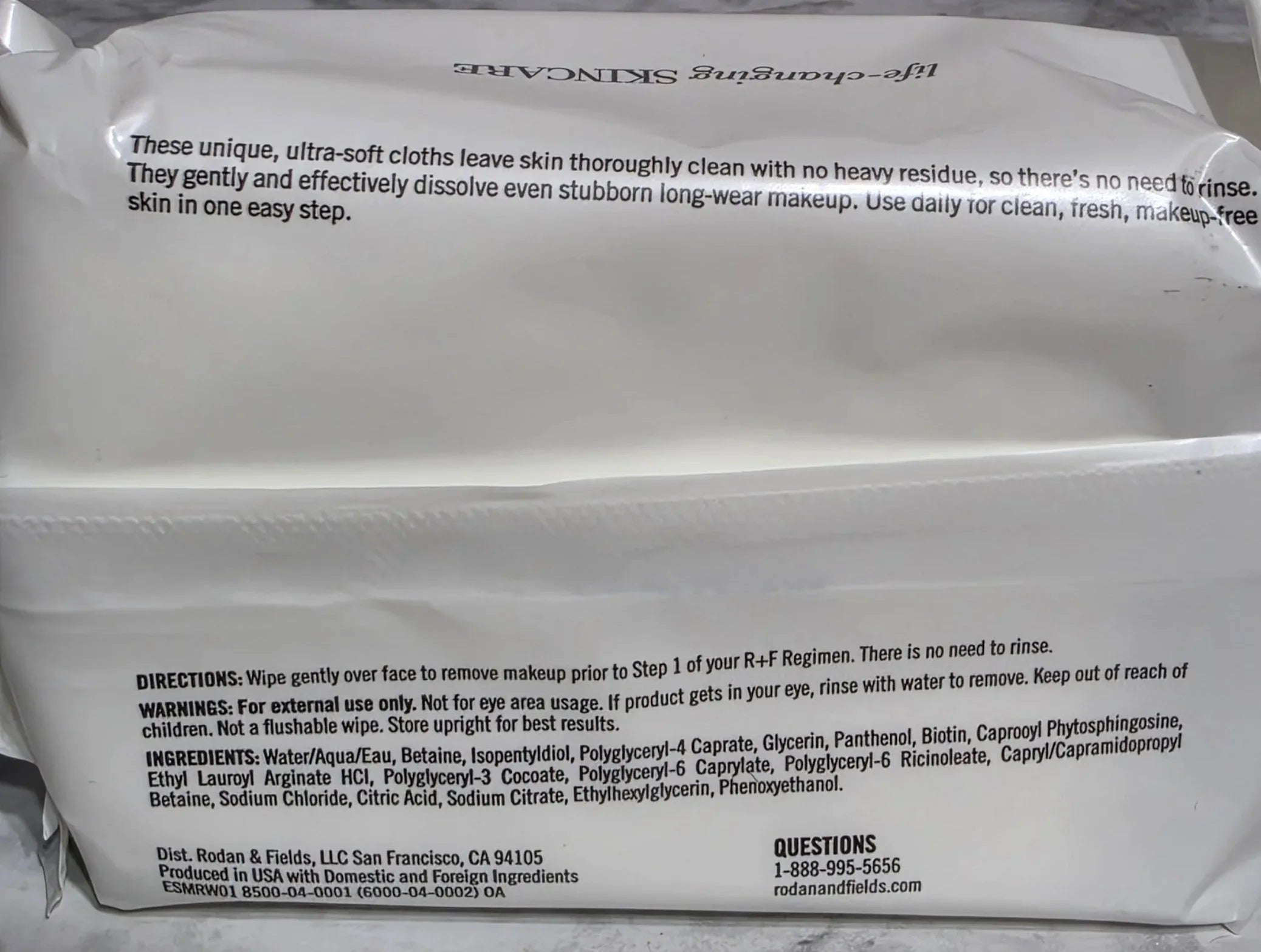 White package with text on a gray marble surface