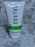 Tube of Rodan + Fields Sooty Gentle Cream Wash on a marble surface