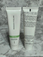 Two skincare products from Rodan + Fields on a marble surface