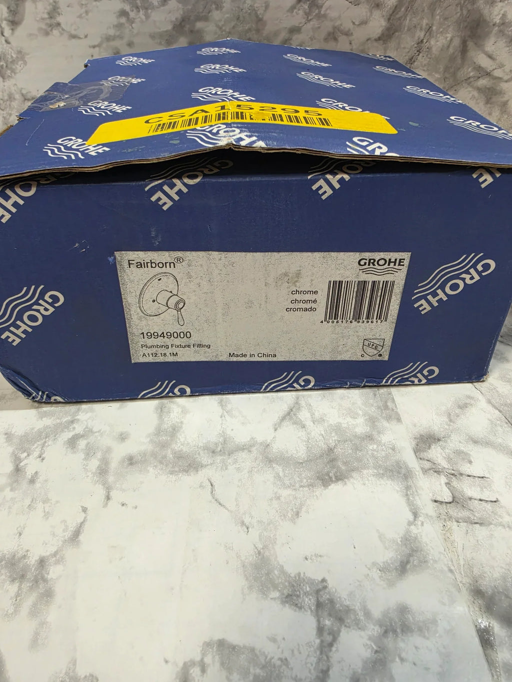 Blue Grohe packaging on a marble surface