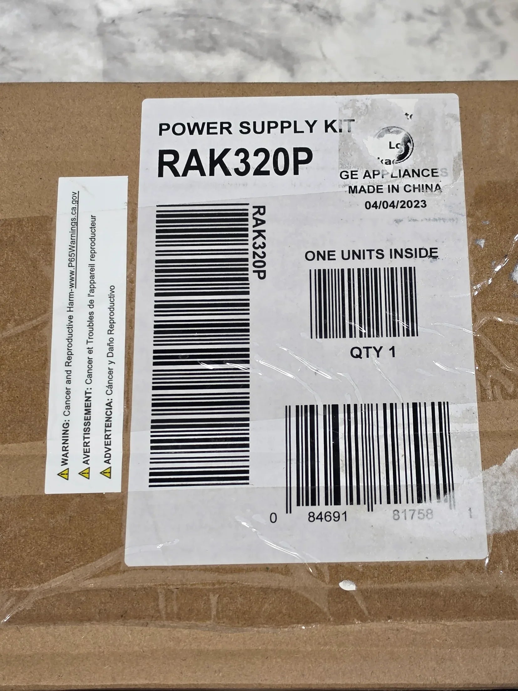 Product label with barcodes and text on a cardboard surface