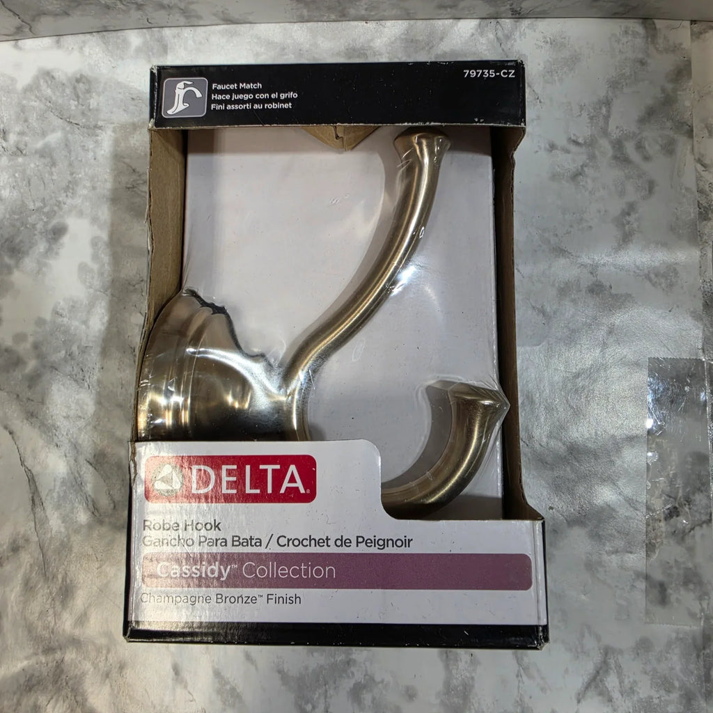Decorative hook in packaging on a marble surface