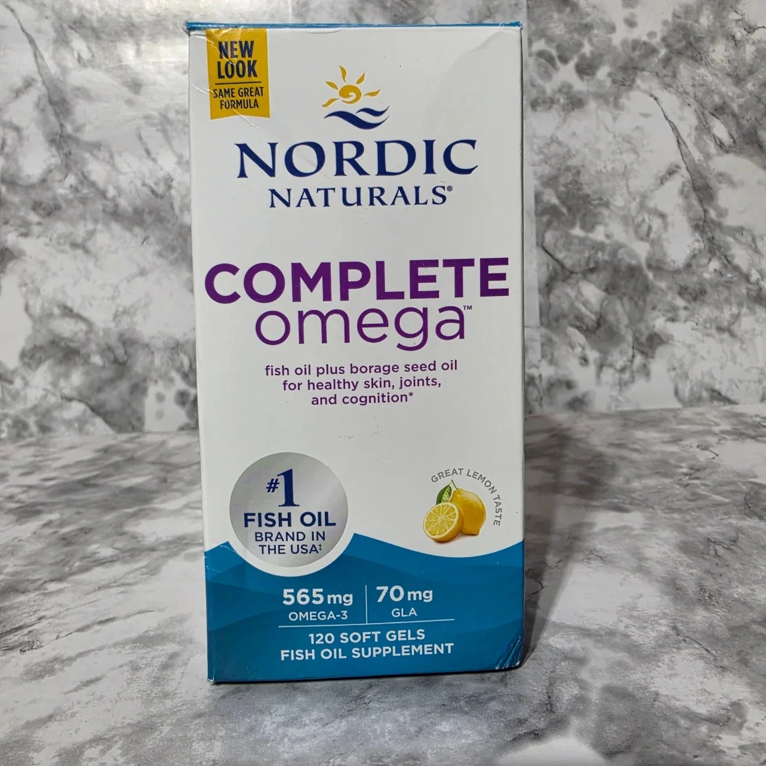 Nordic Naturals Complete Omega supplement box on a marble surface