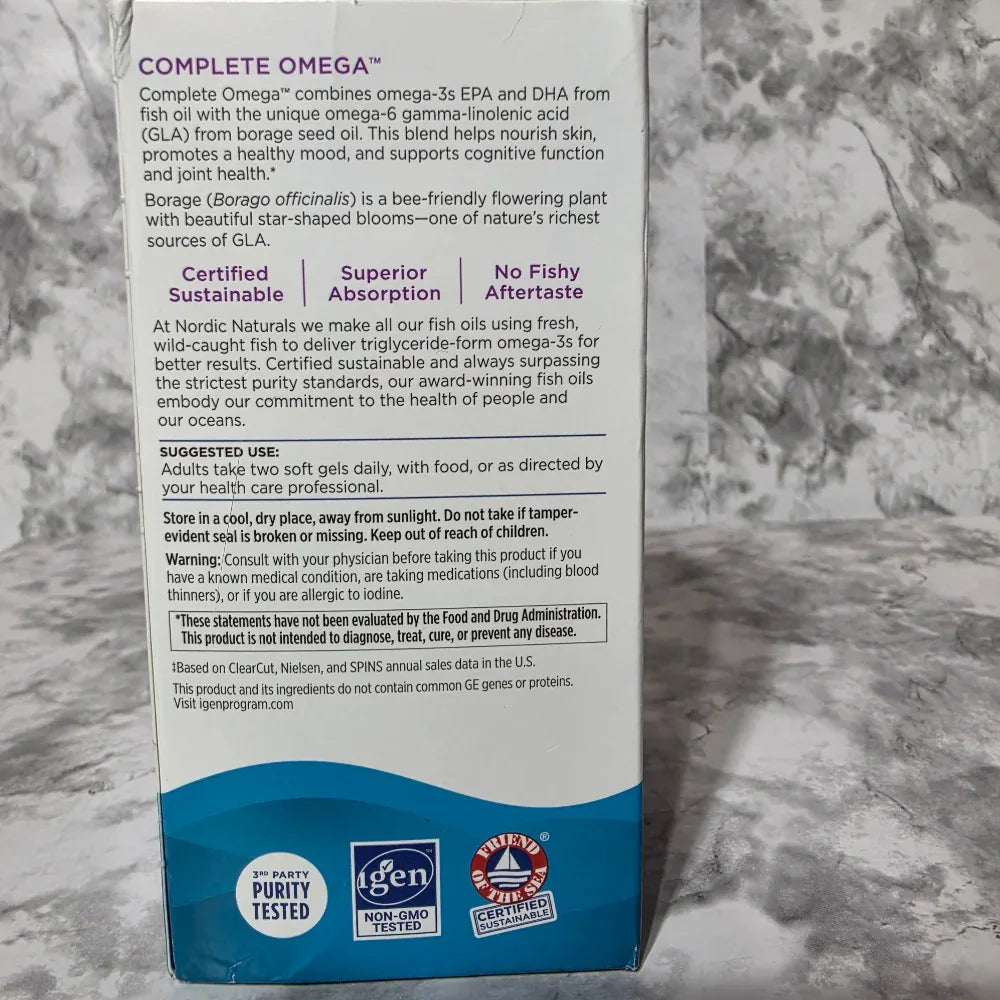 Vitadome Complete Omega supplement box on a marble surface
