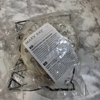 Product packaging with a label on a marble surface