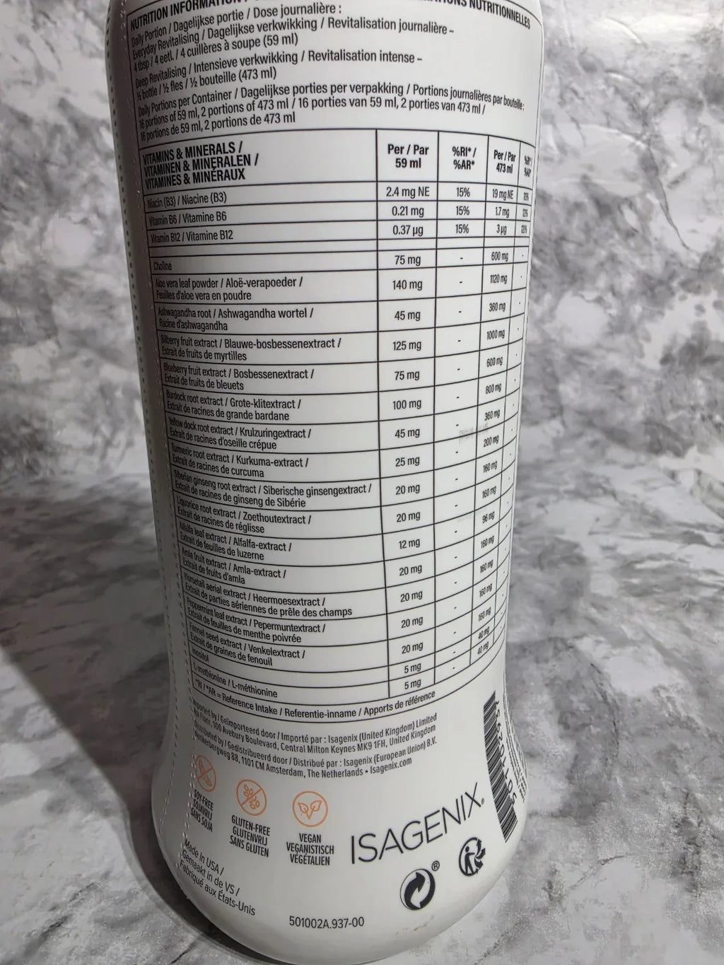 Isagenix supplement container on a marble surface