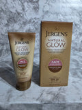 Jergens Natural Glow sun lotion packaging on a marble surface