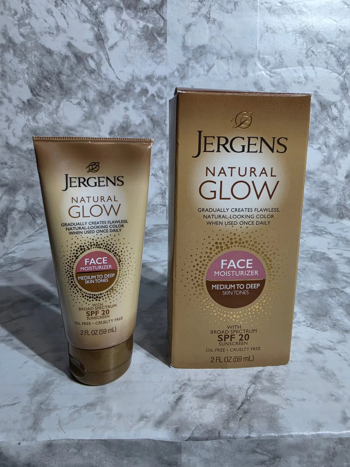 Jergens Natural Glow sun lotion packaging on a marble surface