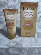 Jergens Natural Glow face moisturizer packaging on a marble surface