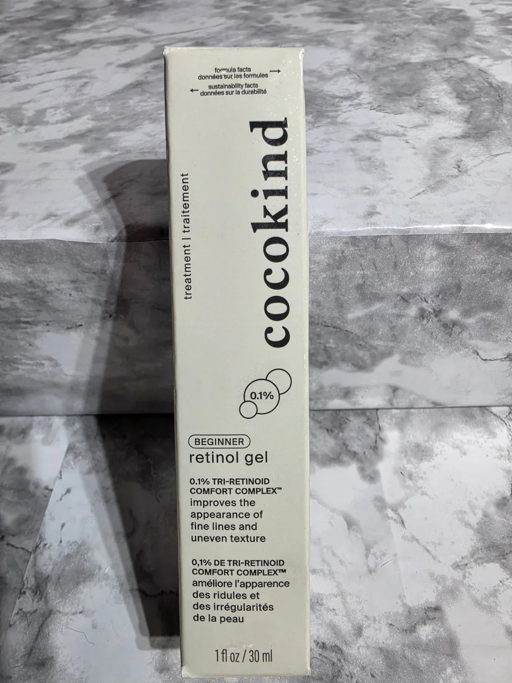 Cocokind retinol gel packaging on a marble surface
