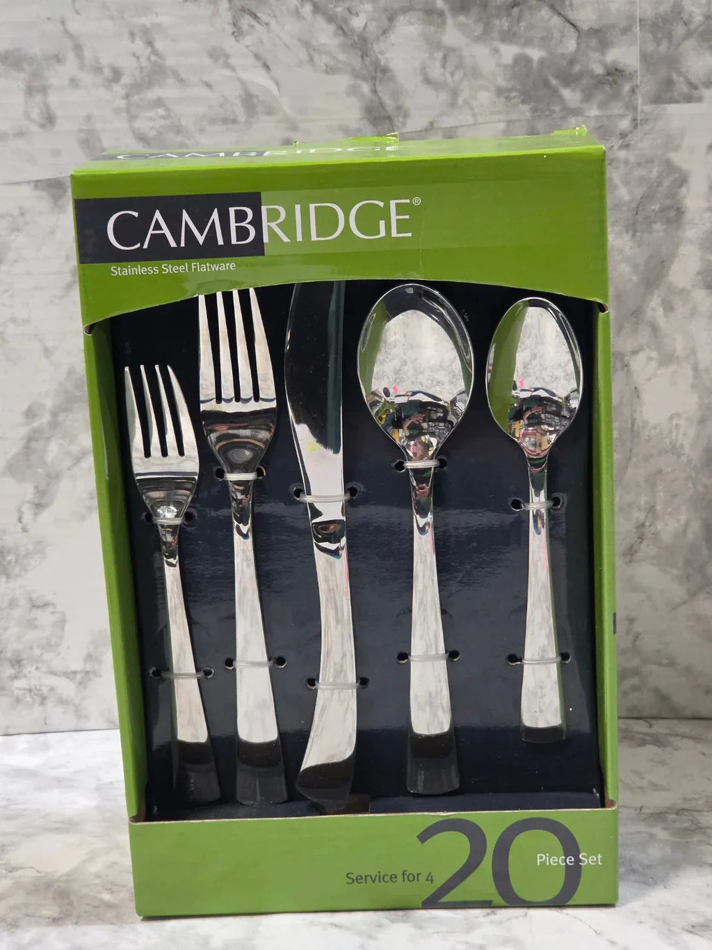 Cambridge cutlery set in packaging on a marble surface