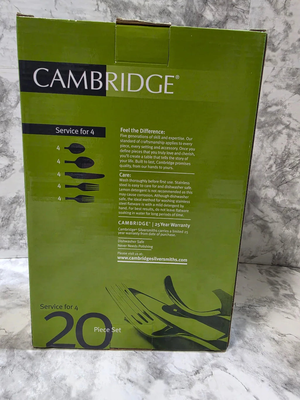 Green Cambridge cutlery set packaging on a marble surface
