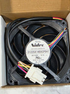 Actual GE WR60X10358 Nidec condenser fan in its open box, showing DC 13.6V 0.1A label and connector