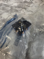Electrical switch in a clear plastic bag on a marble surface