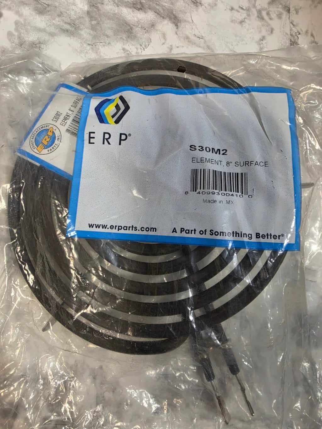 Packaged heating element with ERP label on a marble surface