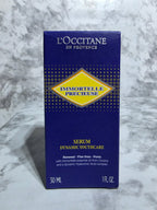L'Occitane serum packaging on a marble surface