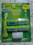 Gillette Venus razor and cartridges packaging on a gray surface