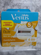 Gillette Venus and Olay packaging on a marble surface