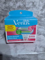 Gillette Venus razor packaging on a marble surface