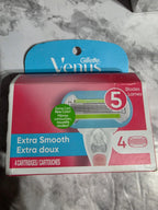 Gillette Venus razor blade packaging on a marble surface