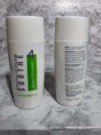 Two skincare products on a marble surface