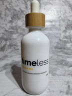 Bottle of 'timeless' serum on a marble surface