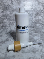 Skincare bottle with pump on a marble surface
