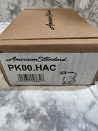 Cardboard box with American Standard branding on a marble surface