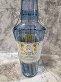 Cocktail shaker set with a label on a marble surface