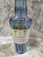 Cocktail shaker set with a label on a marble surface