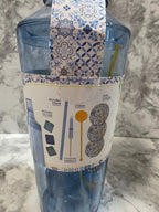 Packaged product with decorative label on a marble surface