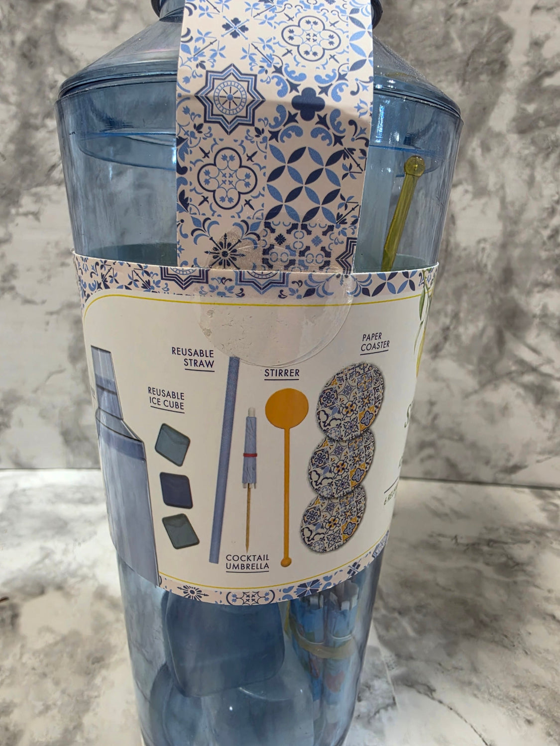 Packaged product with decorative label on a marble surface