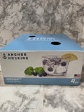 Box of Anchor Hocking glassware on a marble surface