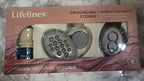 Lifelines grounding stones packaging on a marble surface