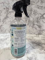 Spray bottle with label on a marble surface