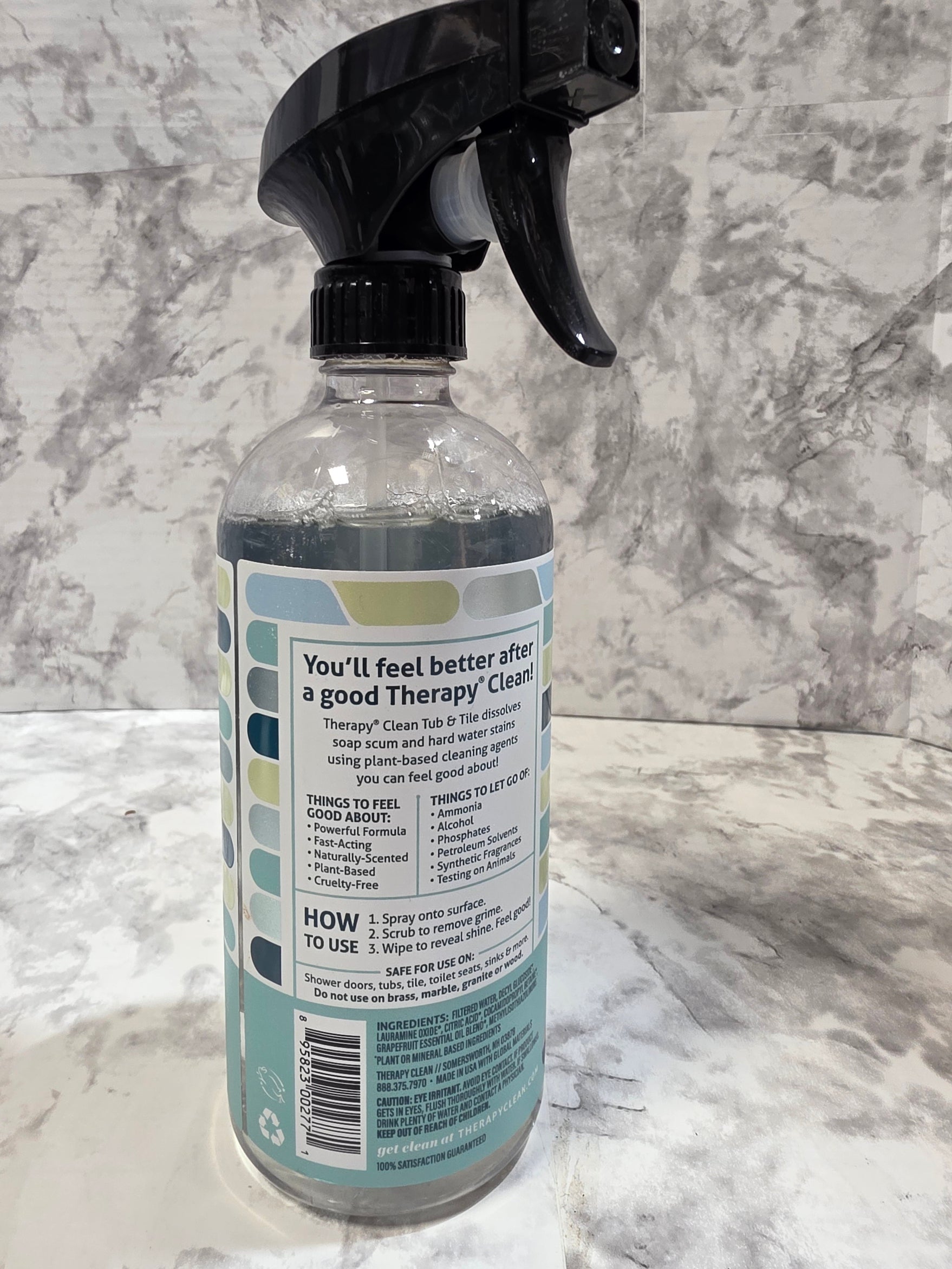 Spray bottle with label on a marble surface