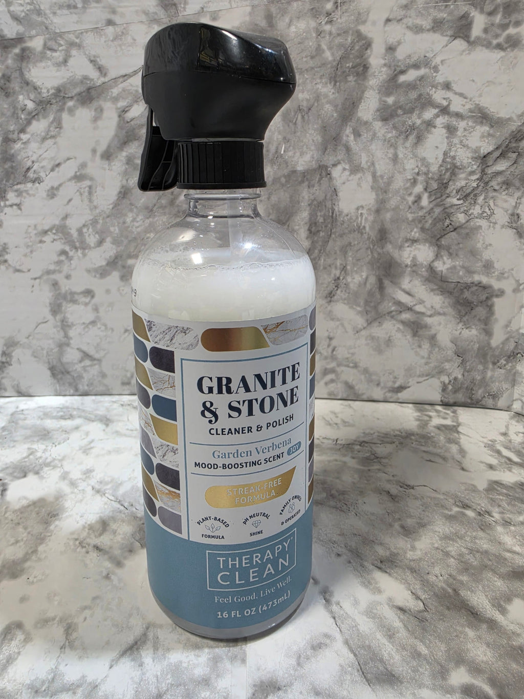 Bottle of Granville & Stone cleaner on a marble surface