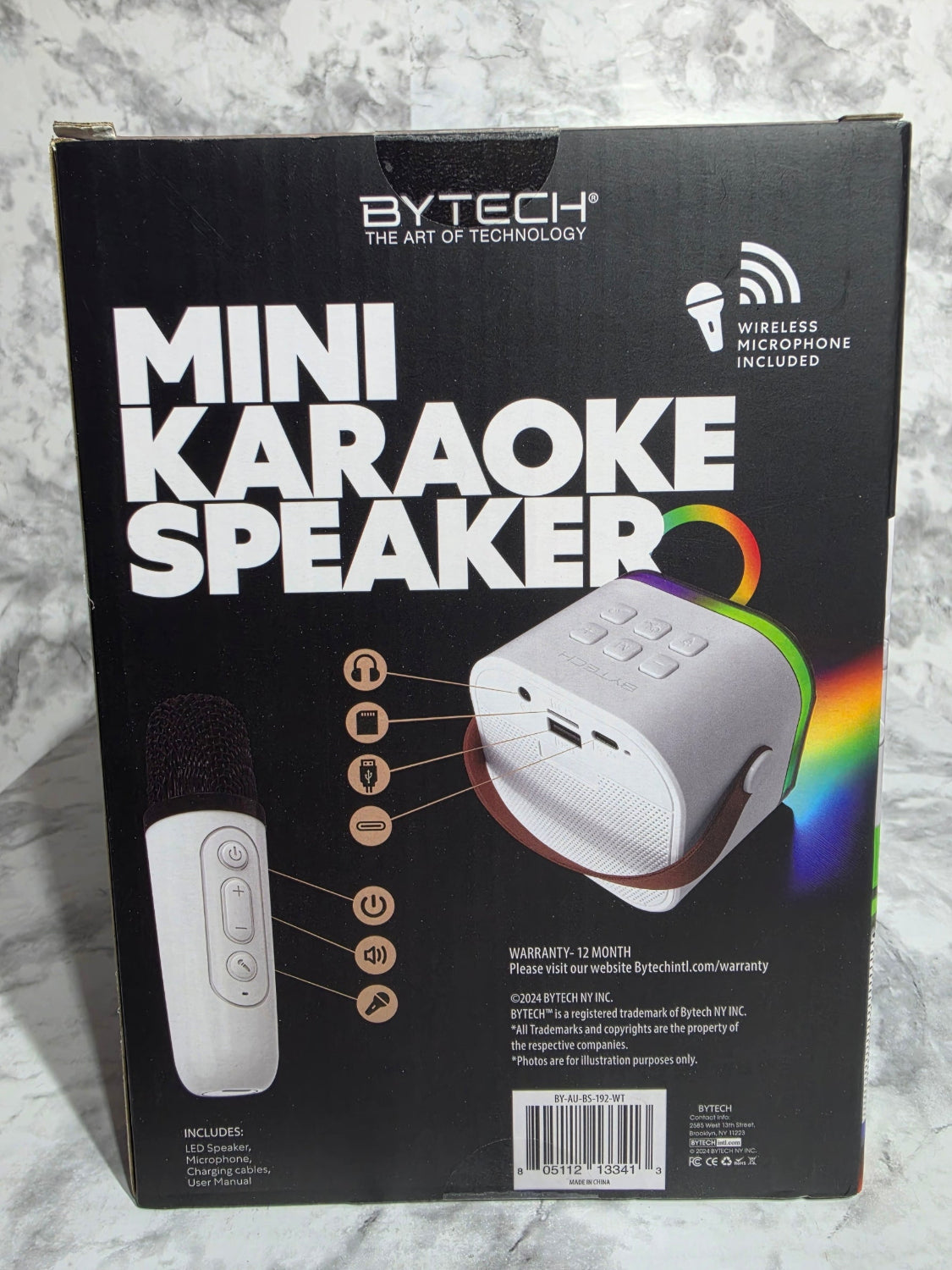 Box for a Bytech Mini Karaoke Speaker on a gray surface