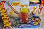 Toy fire station set in its packaging on a marble surface
