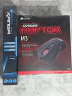 Corsair Raptor M3 gaming mouse box on a textured surface