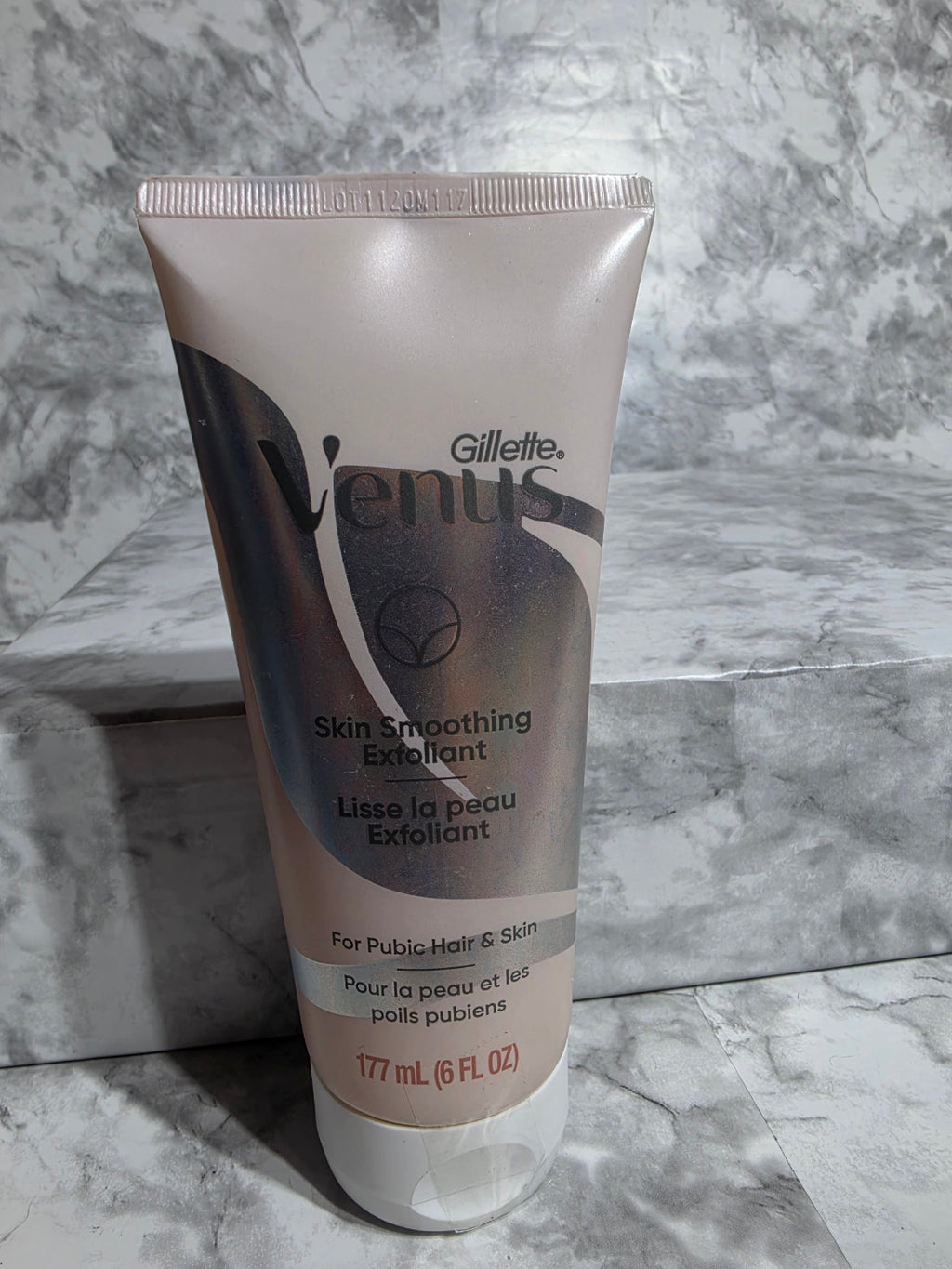 Gillette Embrace skin smoothing exfoliant tube on a marble surface