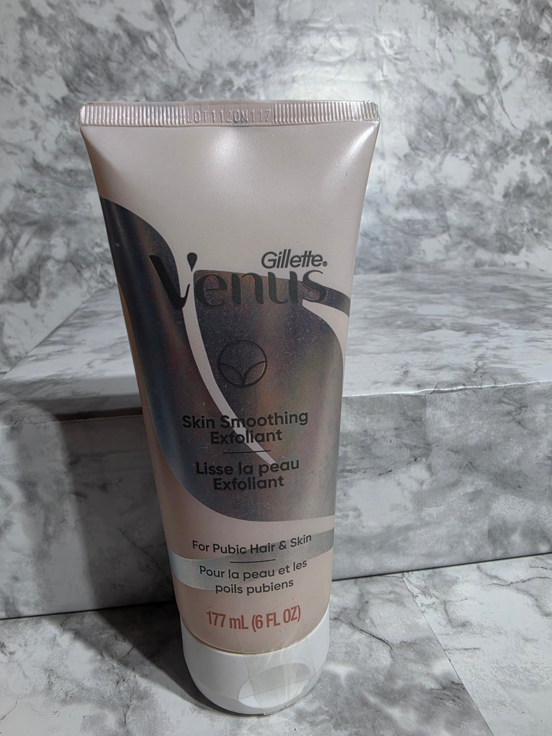 Gillette Embrace skin smoothing exfoliant tube on a marble surface