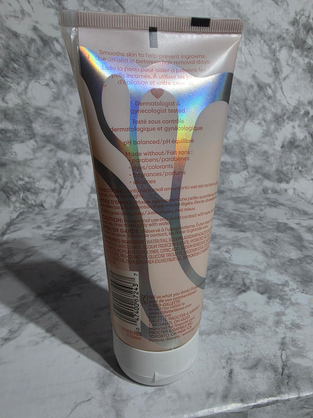Tube of hair product on a marble surface