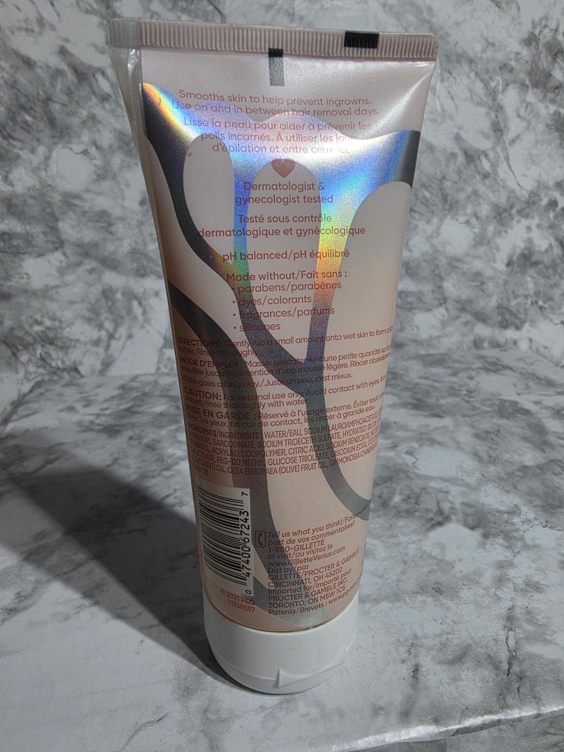 Tube of hair product on a marble surface