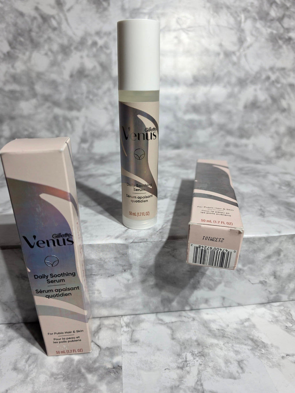 Venus skincare product and packaging on a marble surface