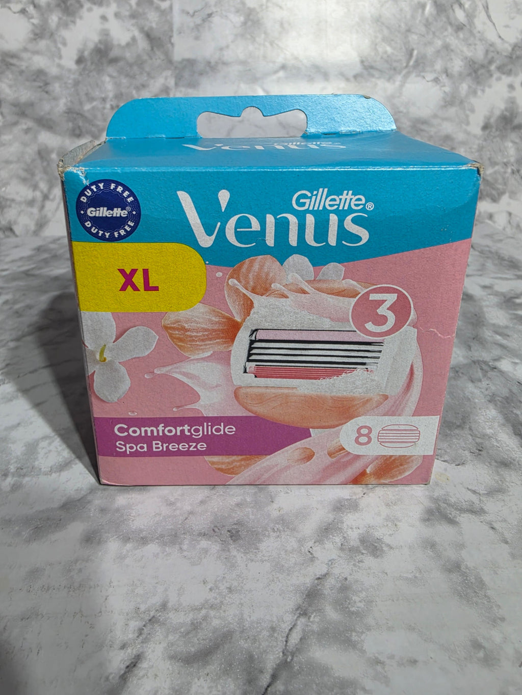 Gillette Venus razor packaging on a marble surface