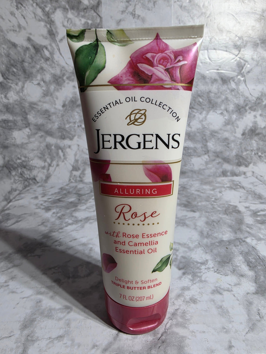 Jergens essential oil collection tube on a marble surface