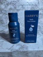 Harry's Daily Face Lotion bottle and packaging on a marble surface