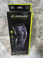 DonJoy Performance knee brace packaging on a marble surface